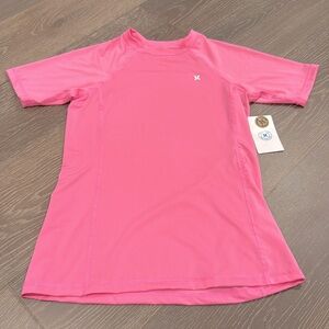 NWT! HURLEY solid pink short sleeve rash guard. Size small.